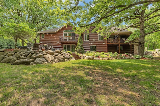 26182 Jericho Rd, Saint Joseph Twp, MN 56301 - back of house featuring a lawn, stairs, a wooden deck, and faux log siding