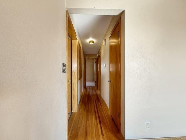 1254 State St, Fairmont, MN 56031 - hallway with light wood-style floors and baseboards