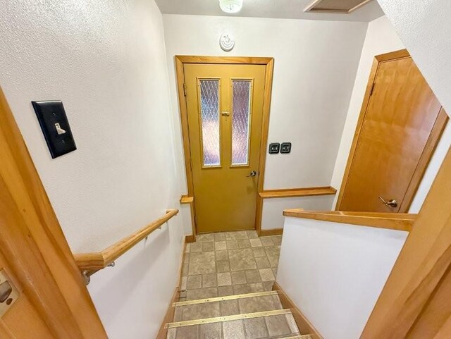 1254 State St, Fairmont, MN 56031 - staircase featuring baseboards