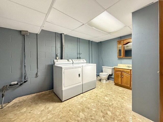 1254 State St, Fairmont, MN 56031 - laundry area with concrete block wall, washer and dryer, and laundry area