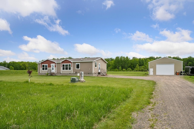 18394 145th Ave, Milaca, MN 56353 - single story home featuring an outbuilding, a garage, driveway, a front yard, and central AC unit