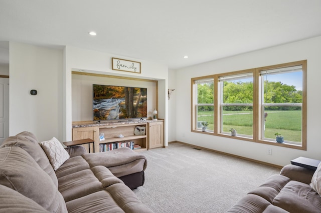 18394 145th Ave, Milaca, MN 56353 - living room featuring light colored carpet, baseboards, and recessed lighting