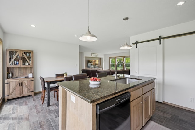 18394 145th Ave, Milaca, MN 56353 - kitchen featuring a sink, dishwasher, a barn door, dark stone countertops, and recessed lighting