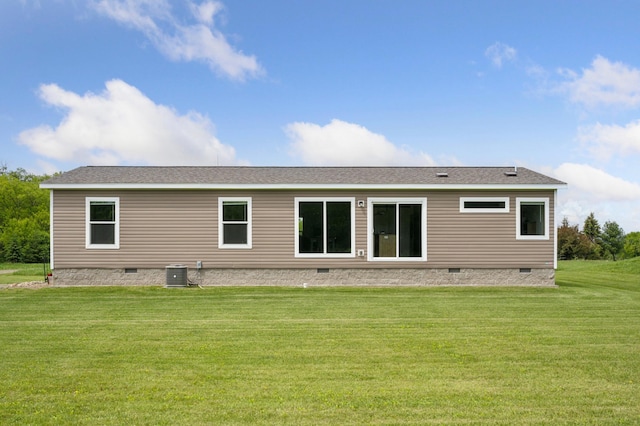18394 145th Ave, Milaca, MN 56353 - back of property featuring crawl space, central AC, a yard, and roof with shingles