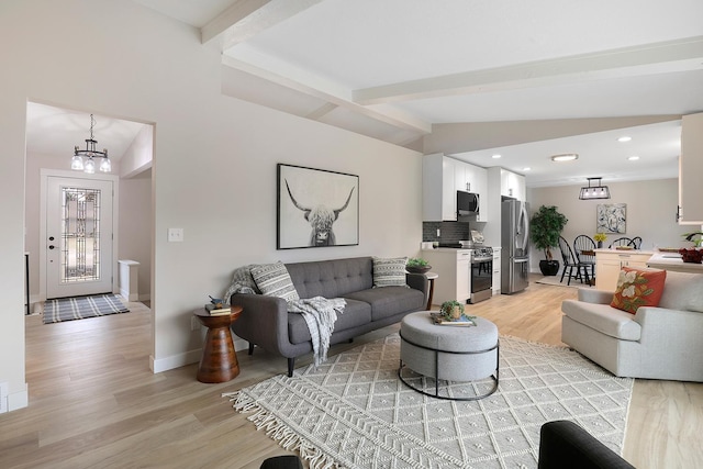 living room featuring recessed lighting, light wood-style floors, baseboards, lofted ceiling with beams, and a notable chandelier