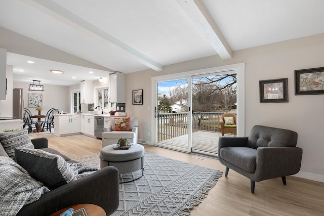 living room featuring light wood-type flooring, vaulted ceiling with beams, baseboards, and recessed lighting