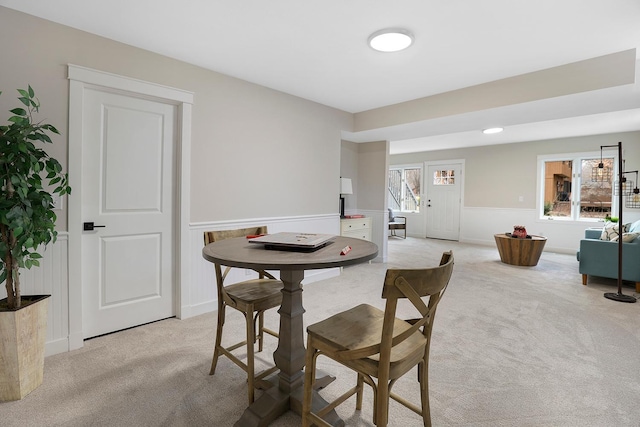dining room with light carpet