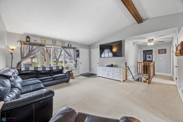 carpeted living area with baseboards and a ceiling fan