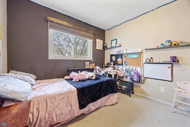 carpeted bedroom featuring a textured ceiling and baseboards