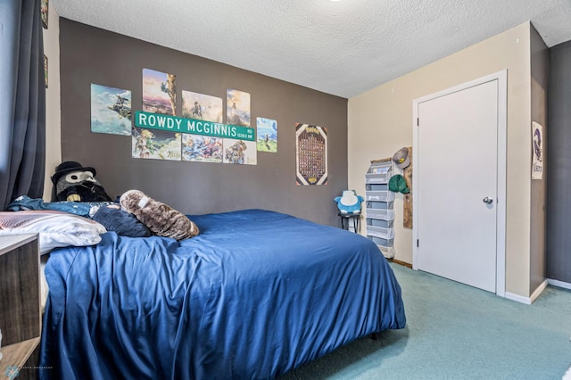 bedroom with carpet and a textured ceiling
