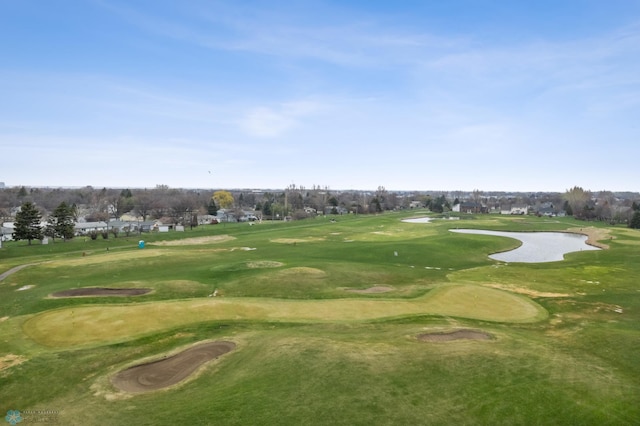 surrounding community with view of golf course