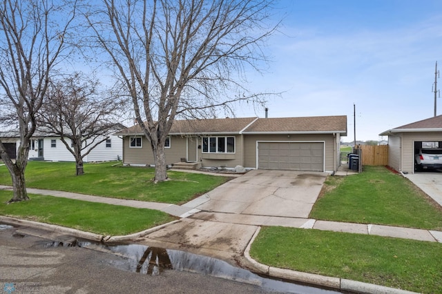 ranch-style home with a garage and concrete driveway