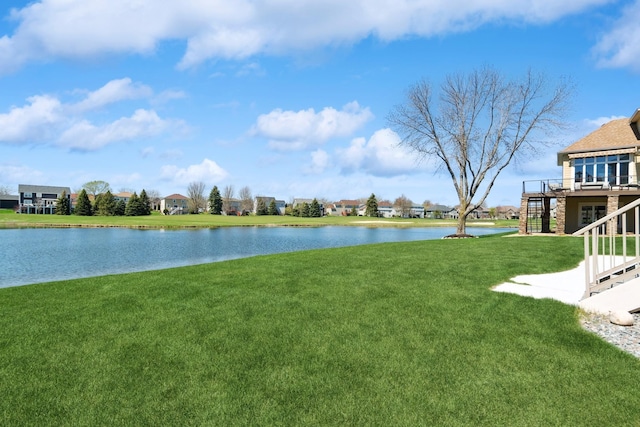 property view of water featuring stairway