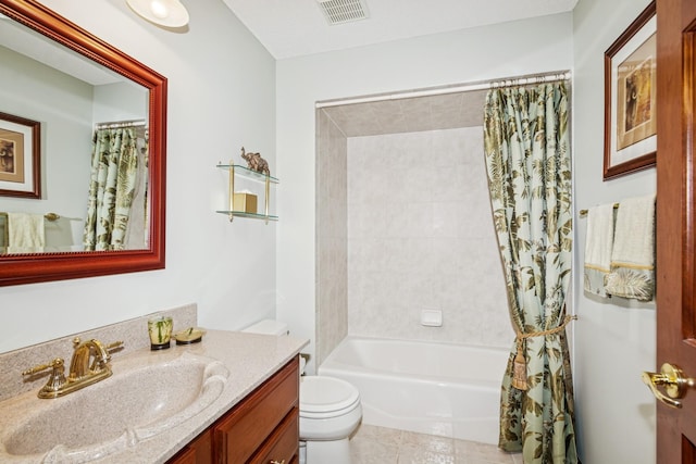 bathroom featuring visible vents, tile patterned flooring, shower / bath combo, vanity, and toilet