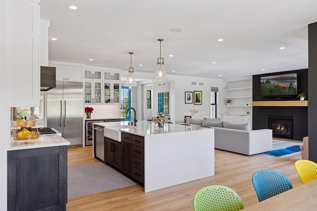 7450 73rd Ct N, Grant, MN 55082 - kitchen with a sink, built in fridge, recessed lighting, white cabinets, and light countertops