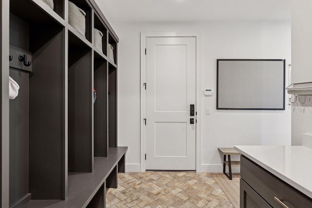 7450 73rd Ct N, Grant, MN 55082 - mudroom featuring brick patterned flooring and baseboards