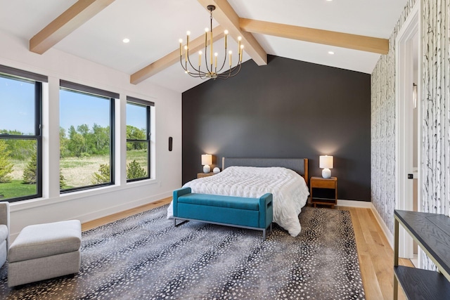 7450 73rd Ct N, Grant, MN 55082 - bedroom featuring wood finished floors, an accent wall, a chandelier, baseboards, and recessed lighting