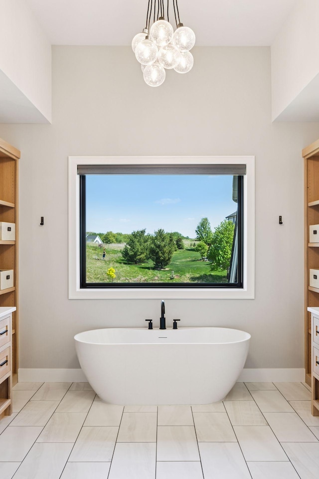 7450 73rd Ct N, Grant, MN 55082 - full bathroom featuring vanity, a freestanding bath, baseboards, and a chandelier