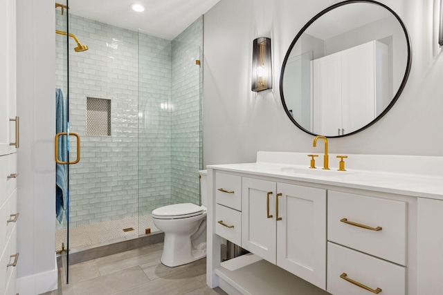 7450 73rd Ct N, Grant, MN 55082 - bathroom featuring a stall shower, toilet, vanity, tile patterned flooring, and recessed lighting
