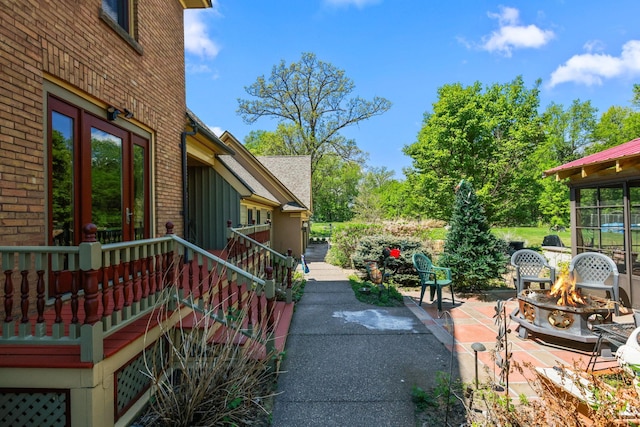 3375 Stark Rd NE, Cambridge Twp, MN 55008 - view of patio / terrace featuring an outdoor fire pit and french doors