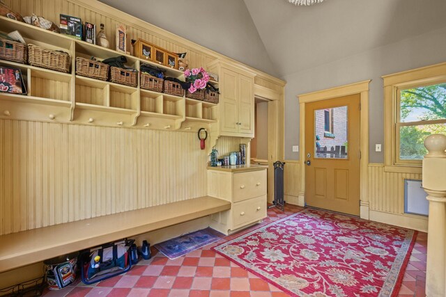 3375 Stark Rd NE, Cambridge Twp, MN 55008 - mudroom with vaulted ceiling, wainscoting, and tile patterned floors