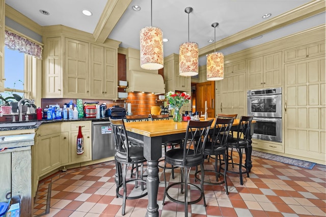 3375 Stark Rd NE, Cambridge Twp, MN 55008 - kitchen featuring stainless steel appliances, backsplash, cream cabinets, pendant lighting, and recessed lighting