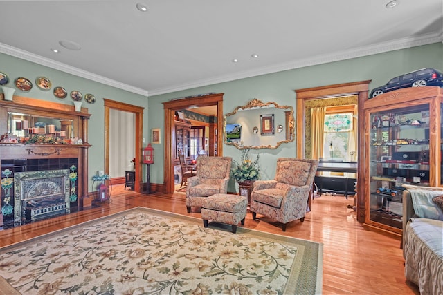 3375 Stark Rd NE, Cambridge Twp, MN 55008 - living area with wood finished floors, a tiled fireplace, ornamental molding, and recessed lighting