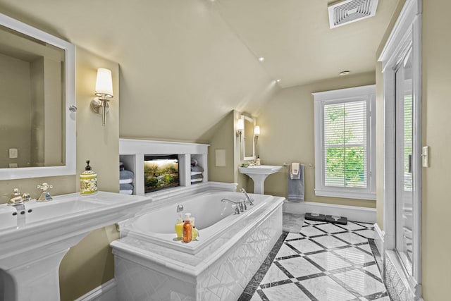 3375 Stark Rd NE, Cambridge Twp, MN 55008 - full bath featuring vaulted ceiling, a bath, and inlaid floor details