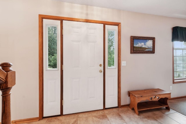 foyer entrance with baseboards