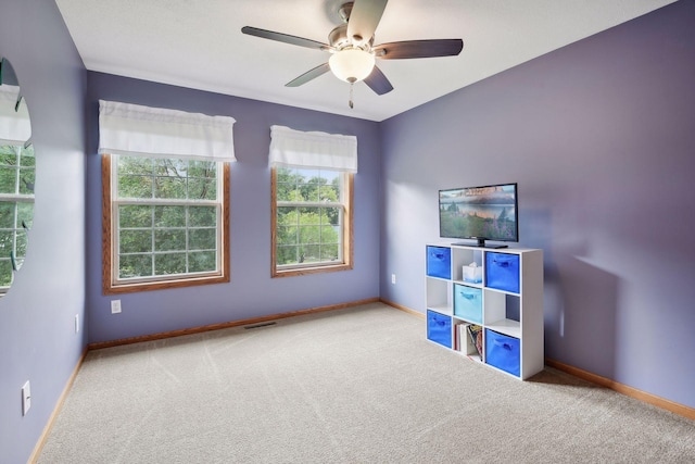 rec room featuring baseboards, ceiling fan, carpet flooring, and visible vents