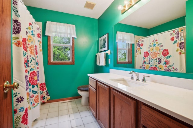 bathroom featuring toilet, tile patterned floors, visible vents, and vanity