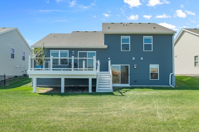 8506 Titanium Cir, Woodbury, MN 55129 - rear view of property featuring stairway, a deck, a lawn, and roof with shingles