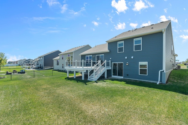 8506 Titanium Cir, Woodbury, MN 55129 - back of house featuring a wooden deck, stairs, a residential view, roof with shingles, and central AC unit