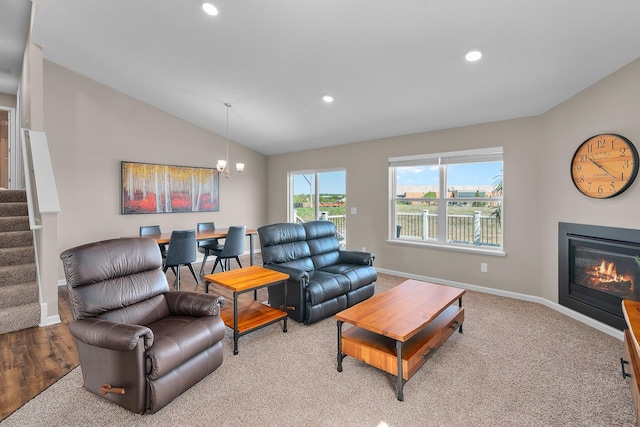 8506 Titanium Cir, Woodbury, MN 55129 - living room with lofted ceiling, recessed lighting, stairway, baseboards, and a chandelier
