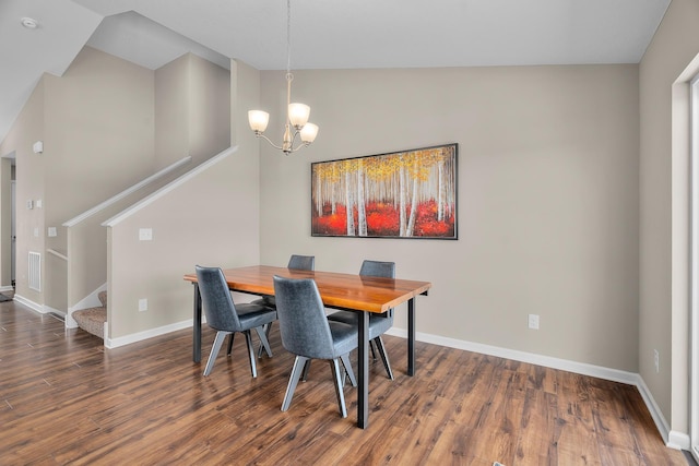 8506 Titanium Cir, Woodbury, MN 55129 - dining area featuring stairs, wood finished floors, baseboards, and a chandelier