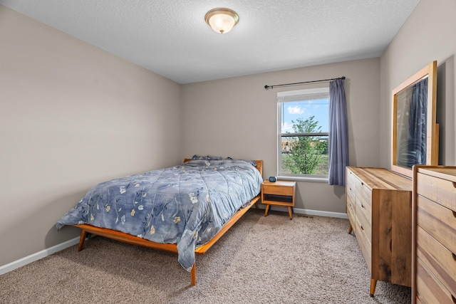 8506 Titanium Cir, Woodbury, MN 55129 - carpeted bedroom featuring baseboards and a textured ceiling