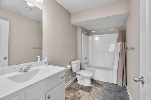 8506 Titanium Cir, Woodbury, MN 55129 - bathroom featuring baseboards, vanity, toilet, shower / bath combo, and stone finish flooring