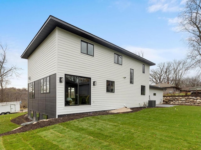 14913 Oakwood Dr, Burnsville, MN 55306 - back of property featuring a yard and cooling unit