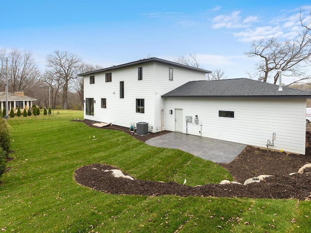 14913 Oakwood Dr, Burnsville, MN 55306 - rear view of property featuring a yard, a patio area, and central AC unit