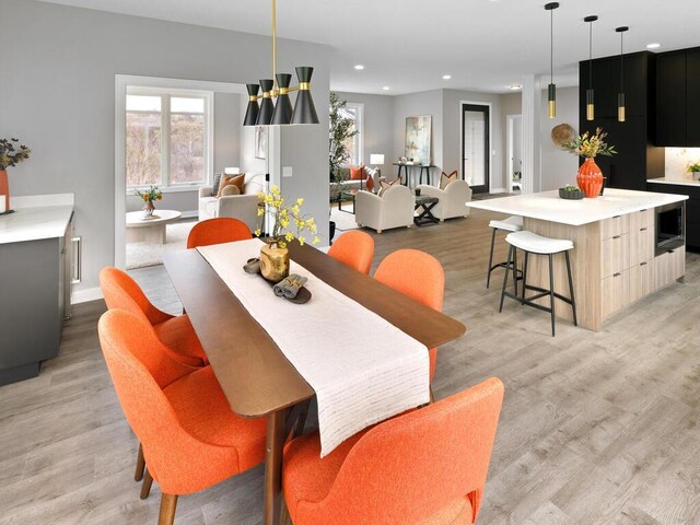 14913 Oakwood Dr, Burnsville, MN 55306 - dining area featuring light wood-type flooring, baseboards, and recessed lighting