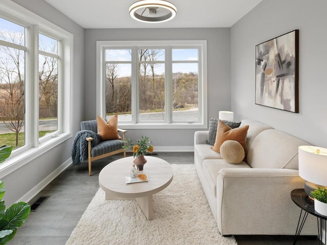 14913 Oakwood Dr, Burnsville, MN 55306 - living area featuring wood finished floors, visible vents, and baseboards