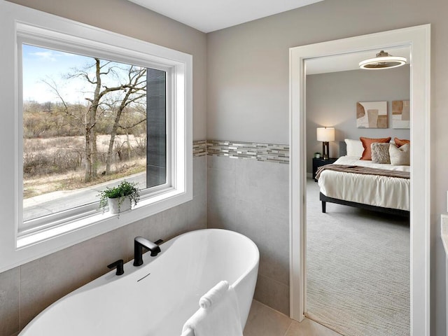 14913 Oakwood Dr, Burnsville, MN 55306 - ensuite bathroom with ensuite bath, tile walls, and a freestanding tub