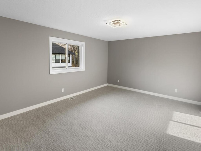 14913 Oakwood Dr, Burnsville, MN 55306 - spare room featuring carpet, visible vents, and baseboards