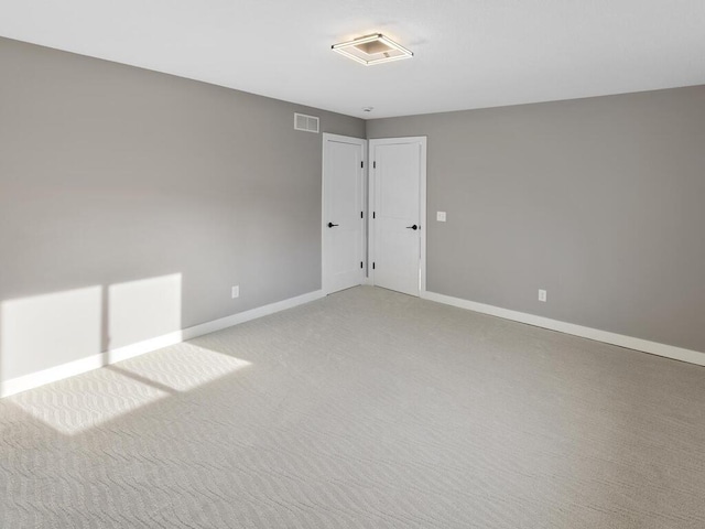 14913 Oakwood Dr, Burnsville, MN 55306 - spare room featuring baseboards, light carpet, and visible vents