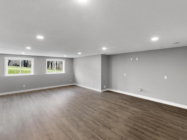 14913 Oakwood Dr, Burnsville, MN 55306 - unfurnished room with recessed lighting, dark wood finished floors, and baseboards