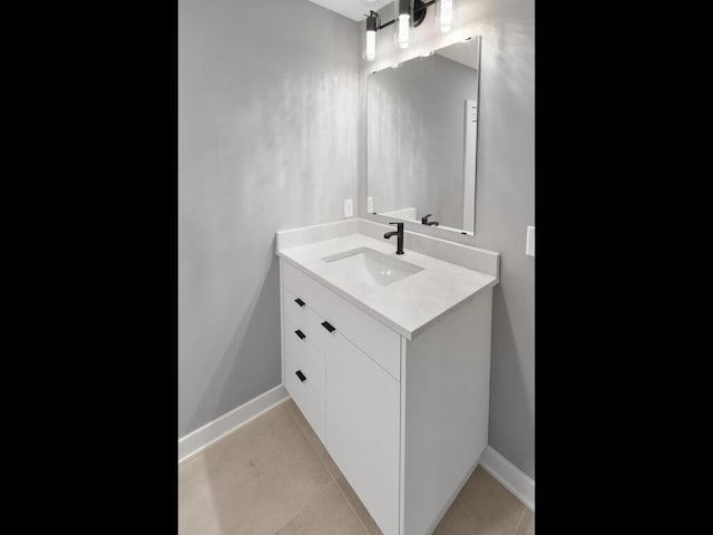 14913 Oakwood Dr, Burnsville, MN 55306 - bathroom featuring baseboards, tile patterned floors, and vanity