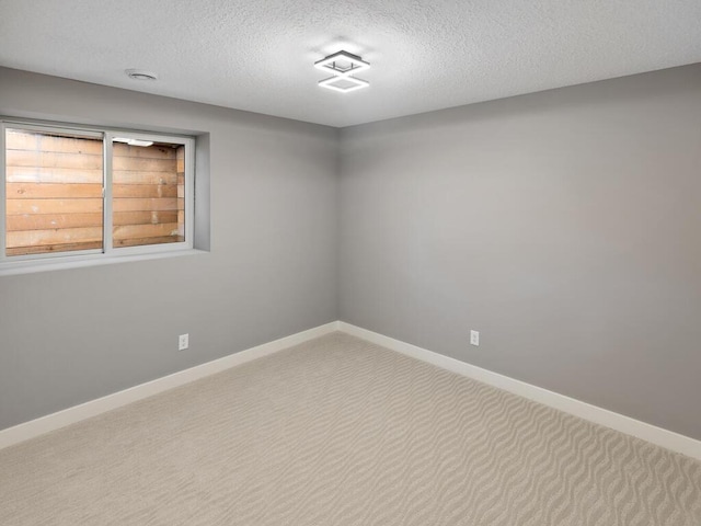 14913 Oakwood Dr, Burnsville, MN 55306 - empty room featuring baseboards, carpet flooring, and a textured ceiling