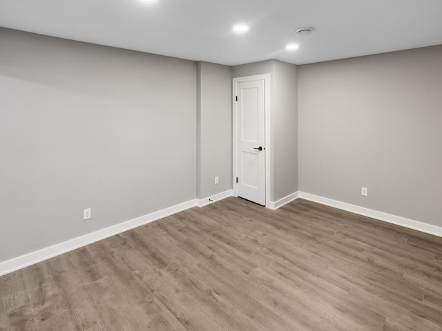 14913 Oakwood Dr, Burnsville, MN 55306 - below grade area featuring baseboards, wood finished floors, and recessed lighting