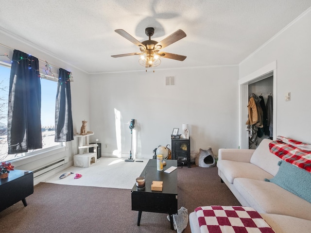 carpeted living room with visible vents, crown molding, baseboard heating, and ceiling fan