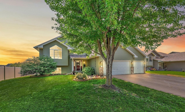 1106 Maplewood Ave SW, Isanti, MN 55040 - split level home with asphalt driveway and an attached garage